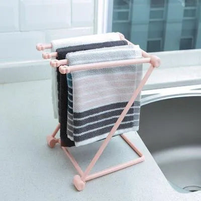 Foldable vertical dishcloth shelf in light blue with punch-free installation for kitchen organisation.