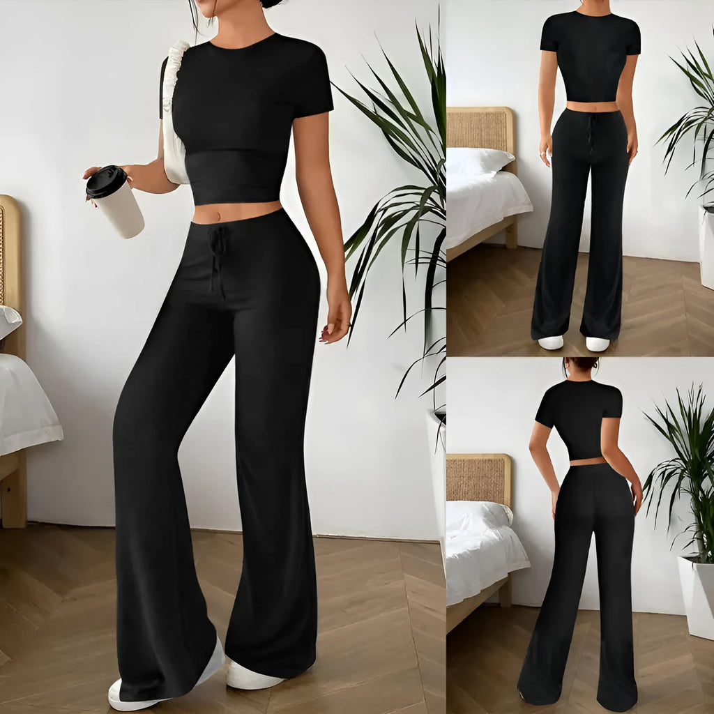 Black polyester two‑piece co‑ordination set with high‑waist trousers and a short‑sleeve t‑shirt.