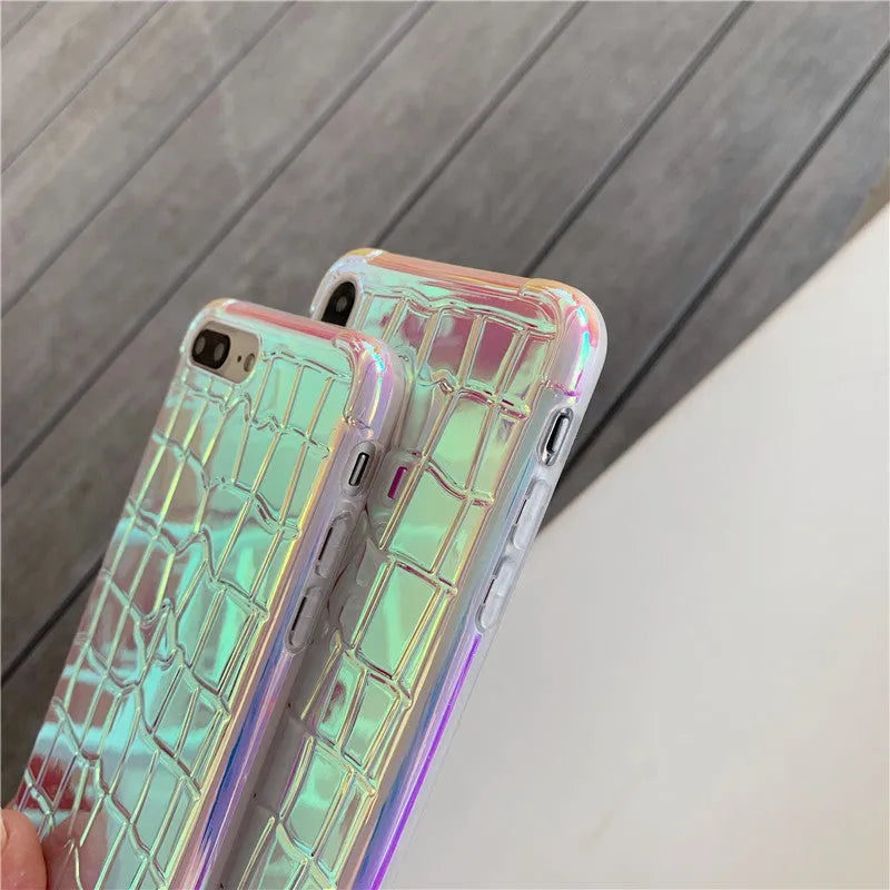 Silver glossy silicone laser phone case with textured surface for iPhone, showing lanyard hole and precise camera cutout.