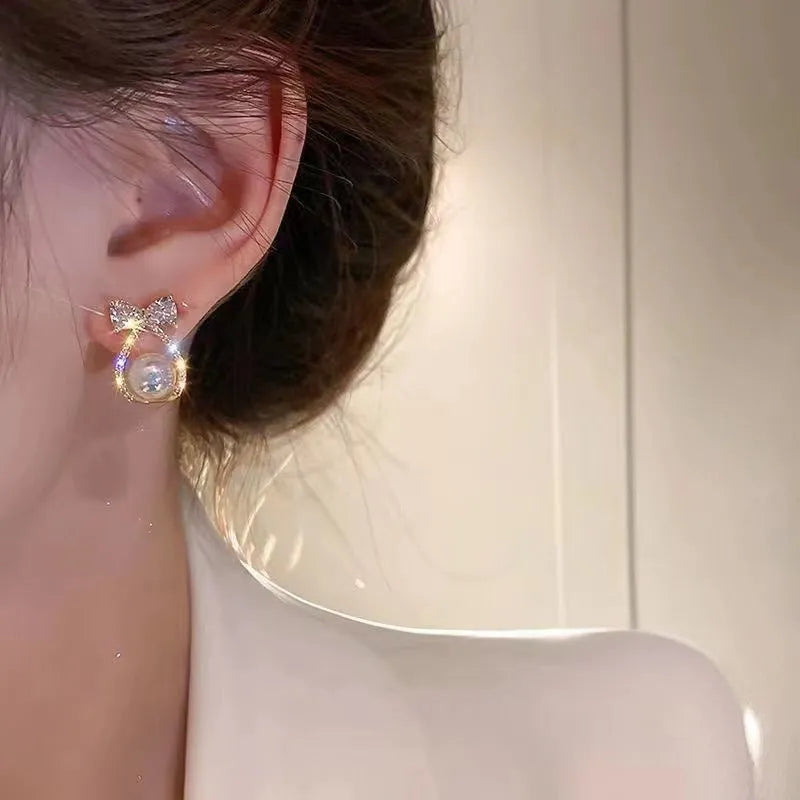 Women's alloy bow earrings with electroplating finish in colour as shown in main image