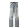 Blue men's straight-leg jeans with ripped details and a zip fly on a neutral background.