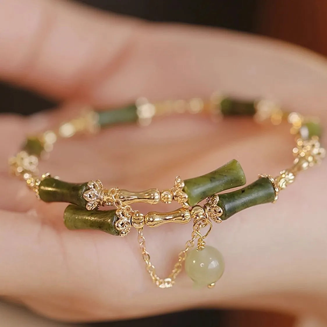Women's bamboo bracelet with coloured glaze beads and a plum wine coloured bamboo joint centrepiece.