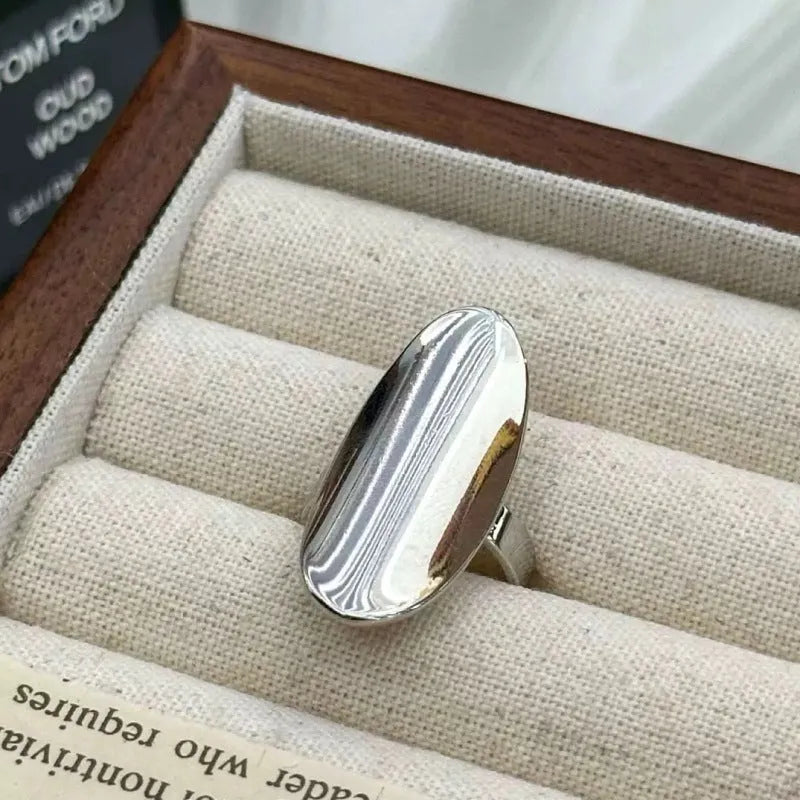 Geometric open ring for women in glossy electroplated silver tone on copper, adjustable band