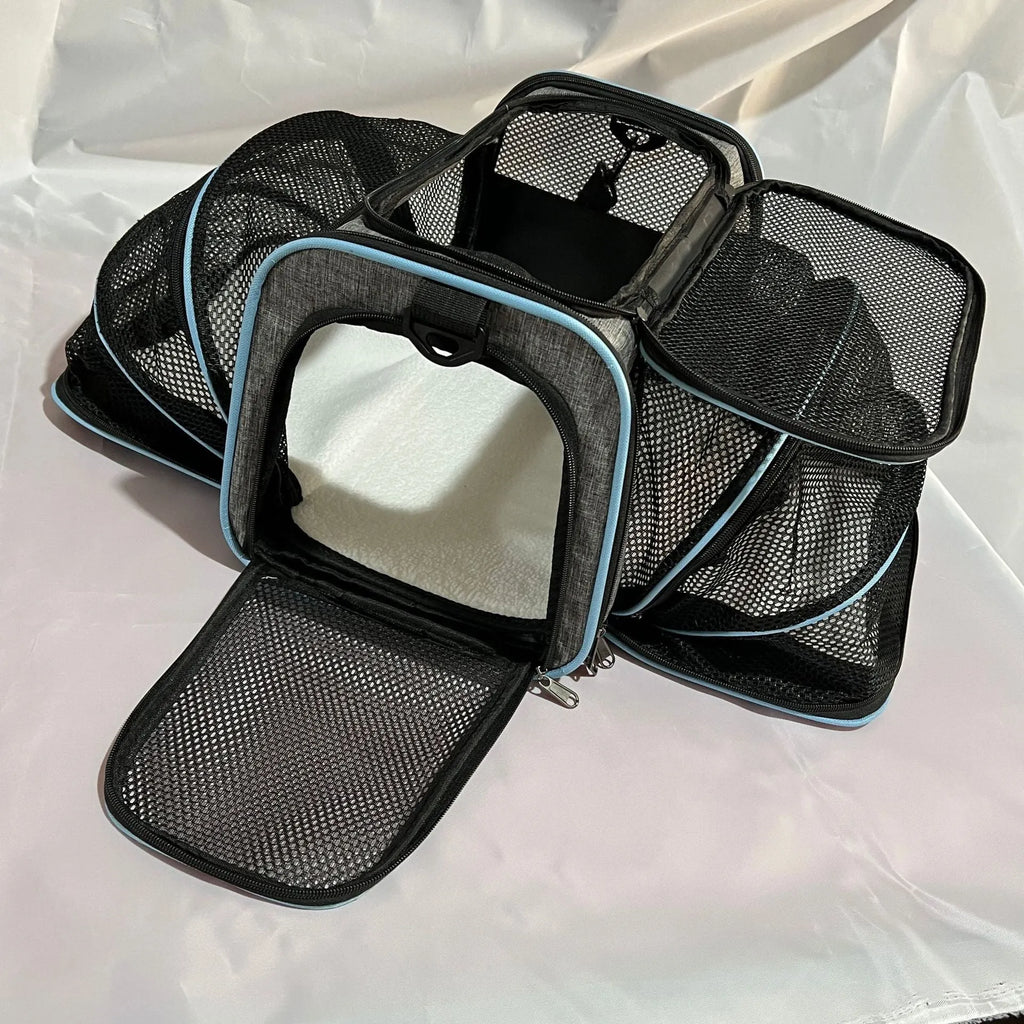 Black 600D cation fabric cat carrier bag with red piping shown in large size