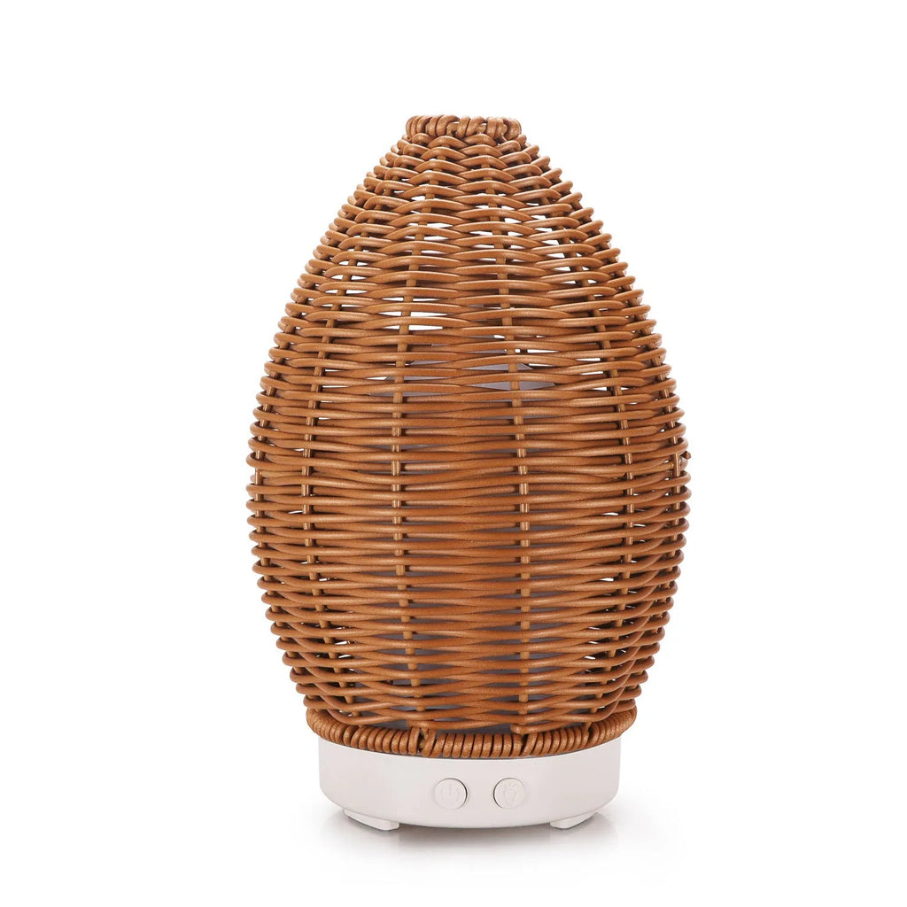 Hollow rattan aroma diffuser with light wood grain base and 100ml capacity for essential oils