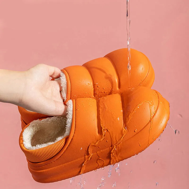 Green waterproof EVA cotton slipper with plush lining, flat sole, and hollow slip-on design.