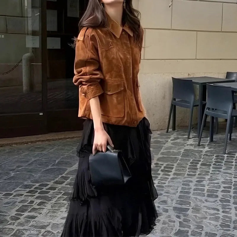 Bright brown suede-effect women's coat with regular sleeves on a hanger