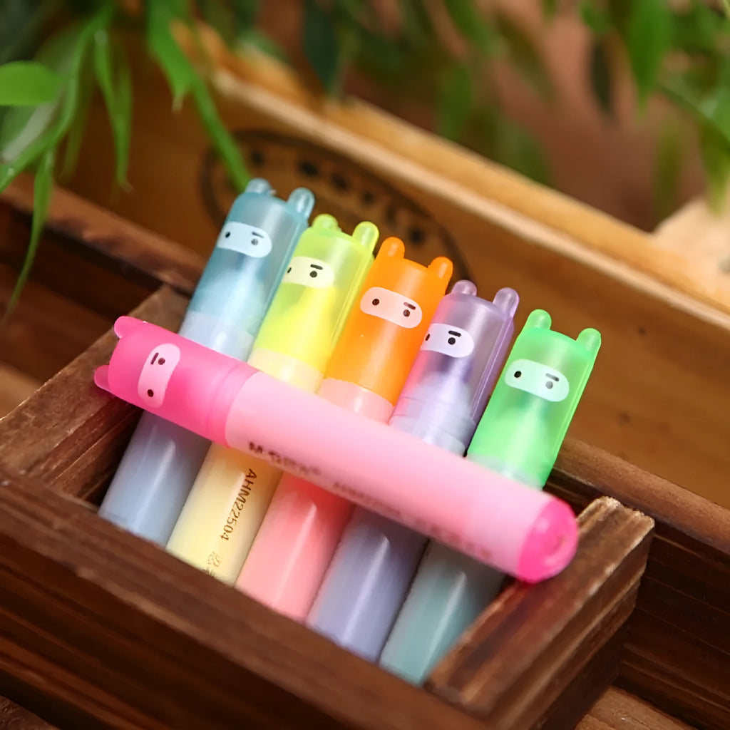 Set of six plastic barrel highlighter pens in yellow, pink, blue, green, orange, and purple colours with oblique tips