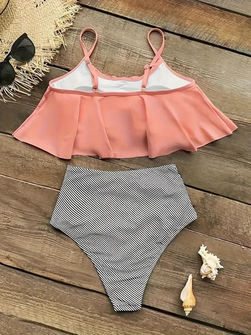Green high-waisted women's swimsuit with ruffles and a backless brief style.