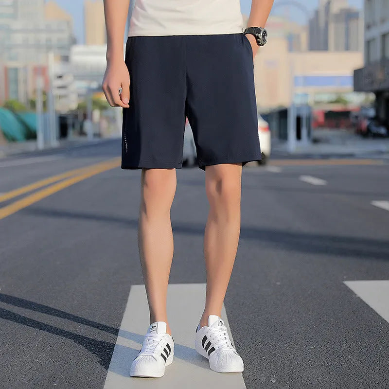 Men's grey cotton quick-drying five-point sports shorts with elastic waistband, front view