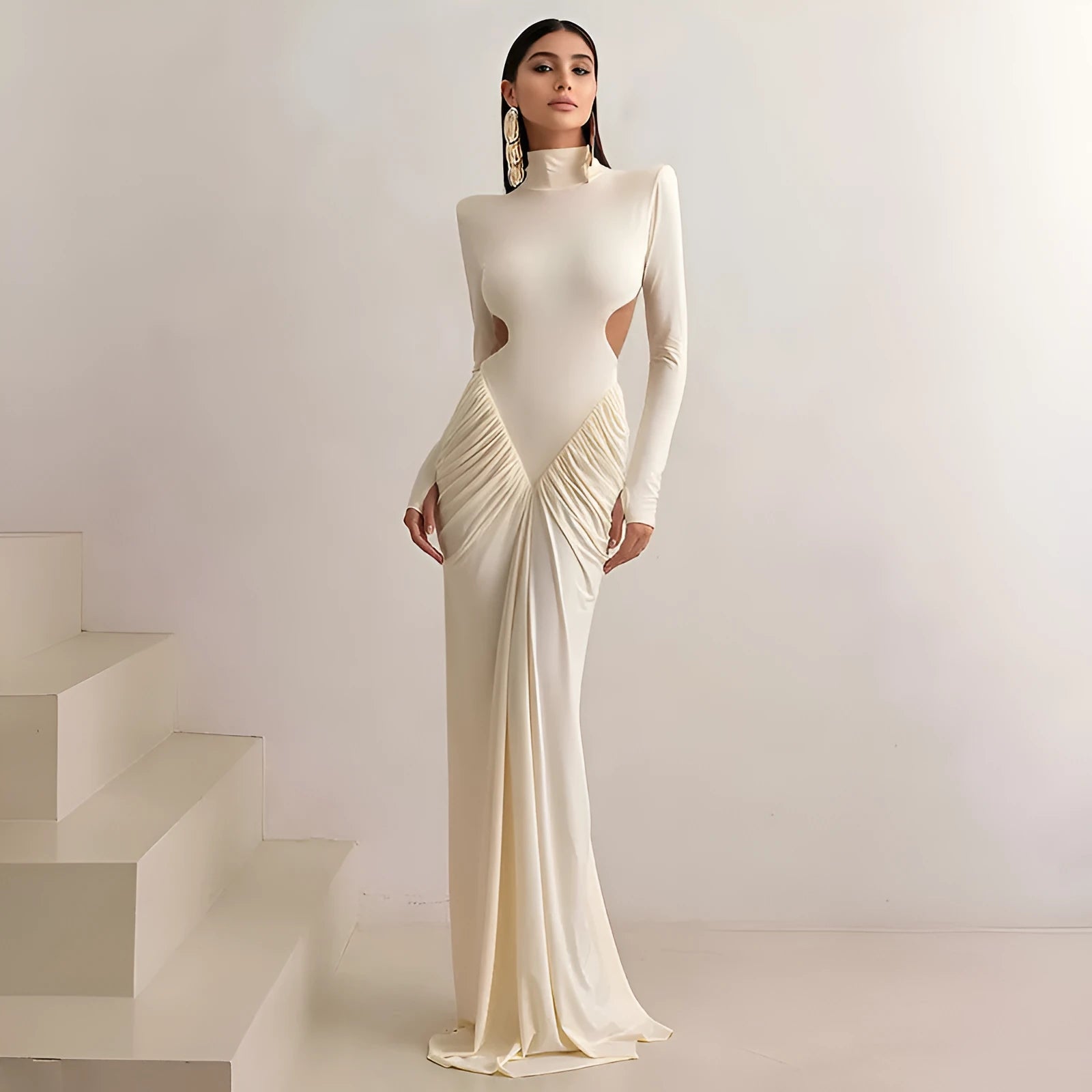 Slim fit long sleeve high collar dress with pleated backless detail in a solid colour.