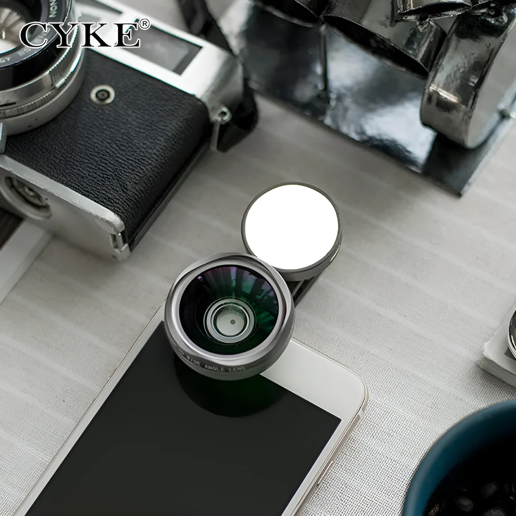 Universal smartphone camera lens kit with wide-angle and macro lenses, LED ring light, and mounting clip in black, red, or silver grey.