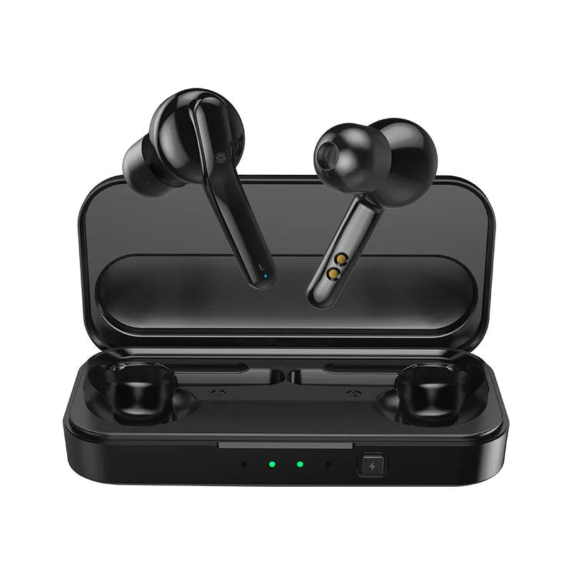 Black and white true wireless stereo earbuds with a compact charging case on a table.
