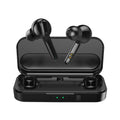 Black and white true wireless stereo earbuds with a compact charging case on a table.