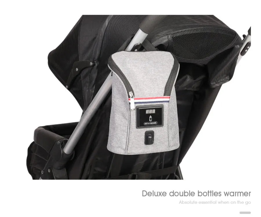 Grey Oxford cloth car USB baby bottle warmer with electronic display, shown with two bottles and car charger.