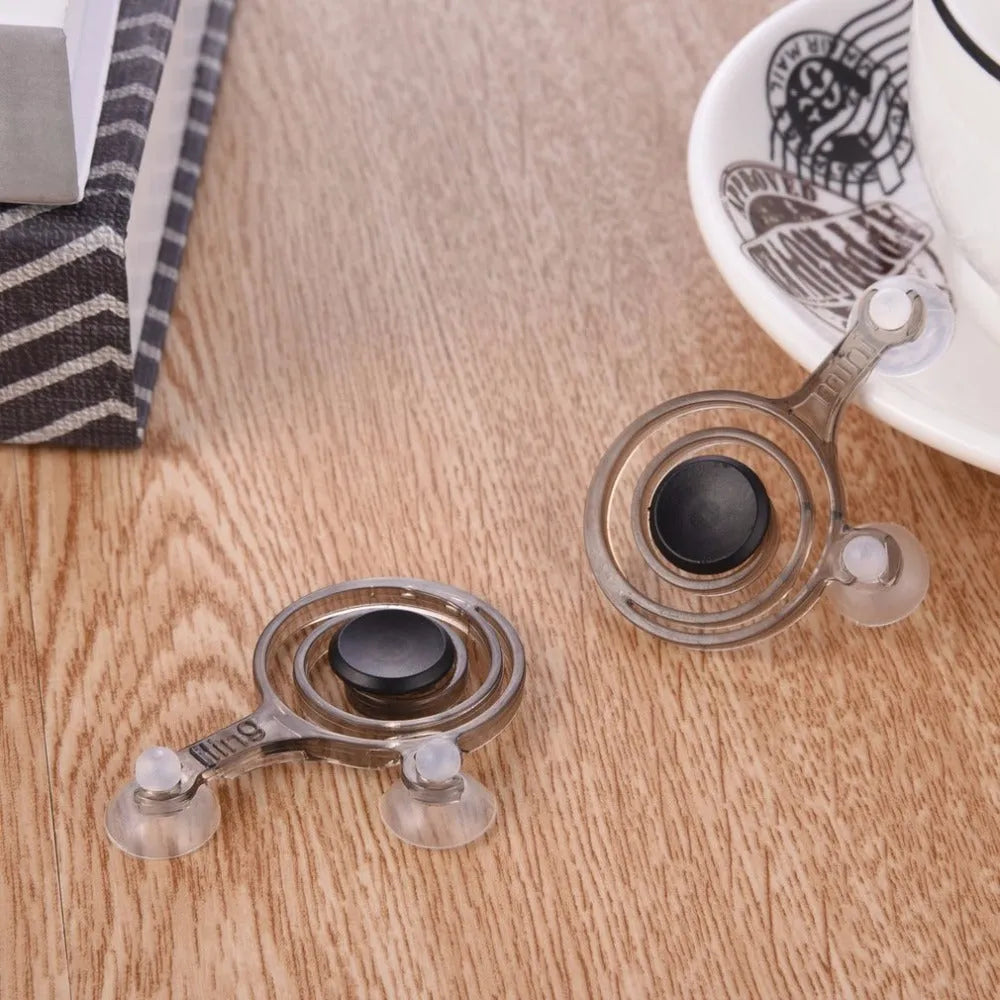 Pair of clear and black universal mini joysticks for mobile phone touch-screen gaming.