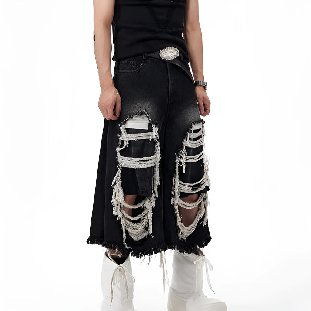 Black wide-leg cropped jeans with distressed patchwork detail and a mid-high waist.