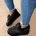 Women's white cotton slippers with a round toe and non-slip rubber sole.