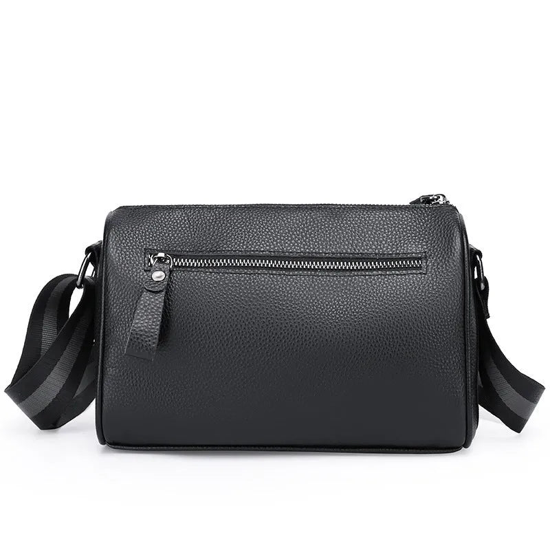Black genuine leather crossbody bag with dimensions 24x16x13cm showing large capacity and polyester lining