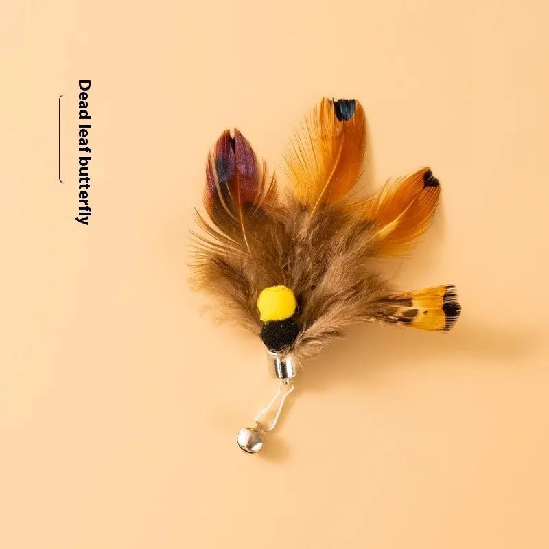 Three steel wire cat toy replacement heads shaped like small flying insects on a white background