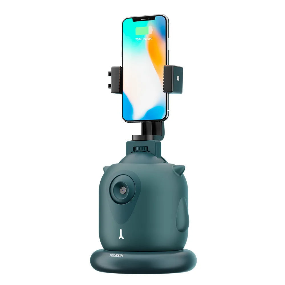Dark green intelligent AI tracking gimbal with 360 rotation on a desktop.