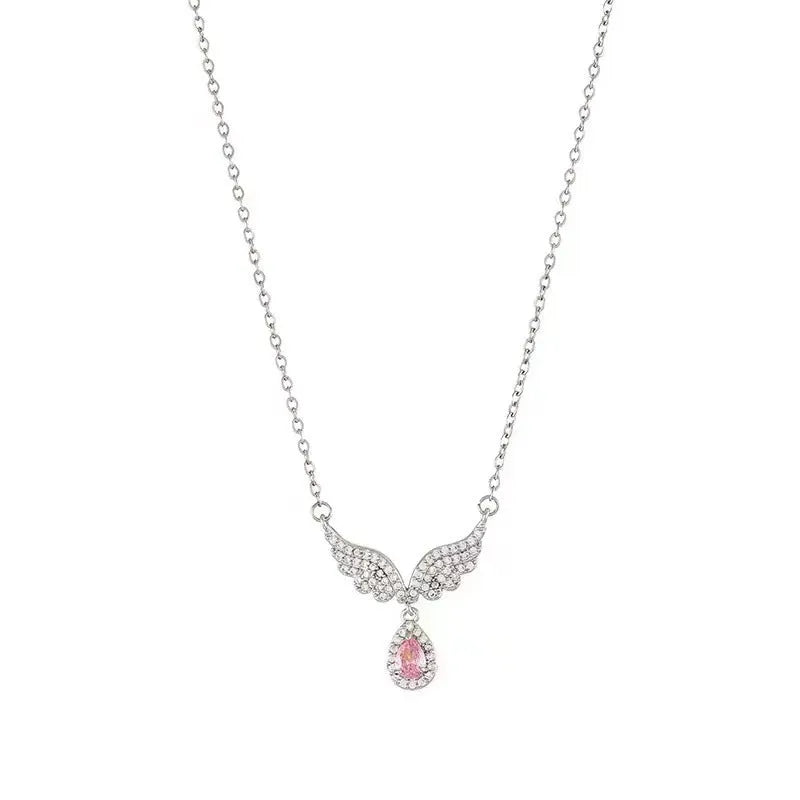 Simple sterling silver necklace with a geometric fishtail or angel wing pendant on an O-ring chain.
