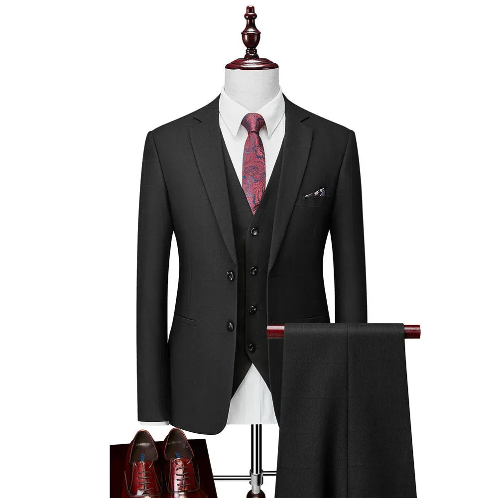 Men's navy blue three-piece plaid business casual suit with slim fit cut showing jacket, vest, and trousers