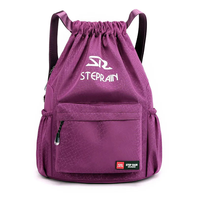 Lightweight solid colour Oxford cloth backpack with drawstring closure and double shoulder straps.