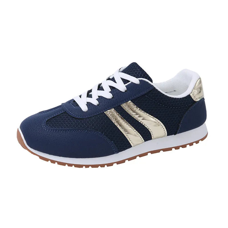 Blue women's lace-up tennis shoes with cross shoulder straps and a round toe