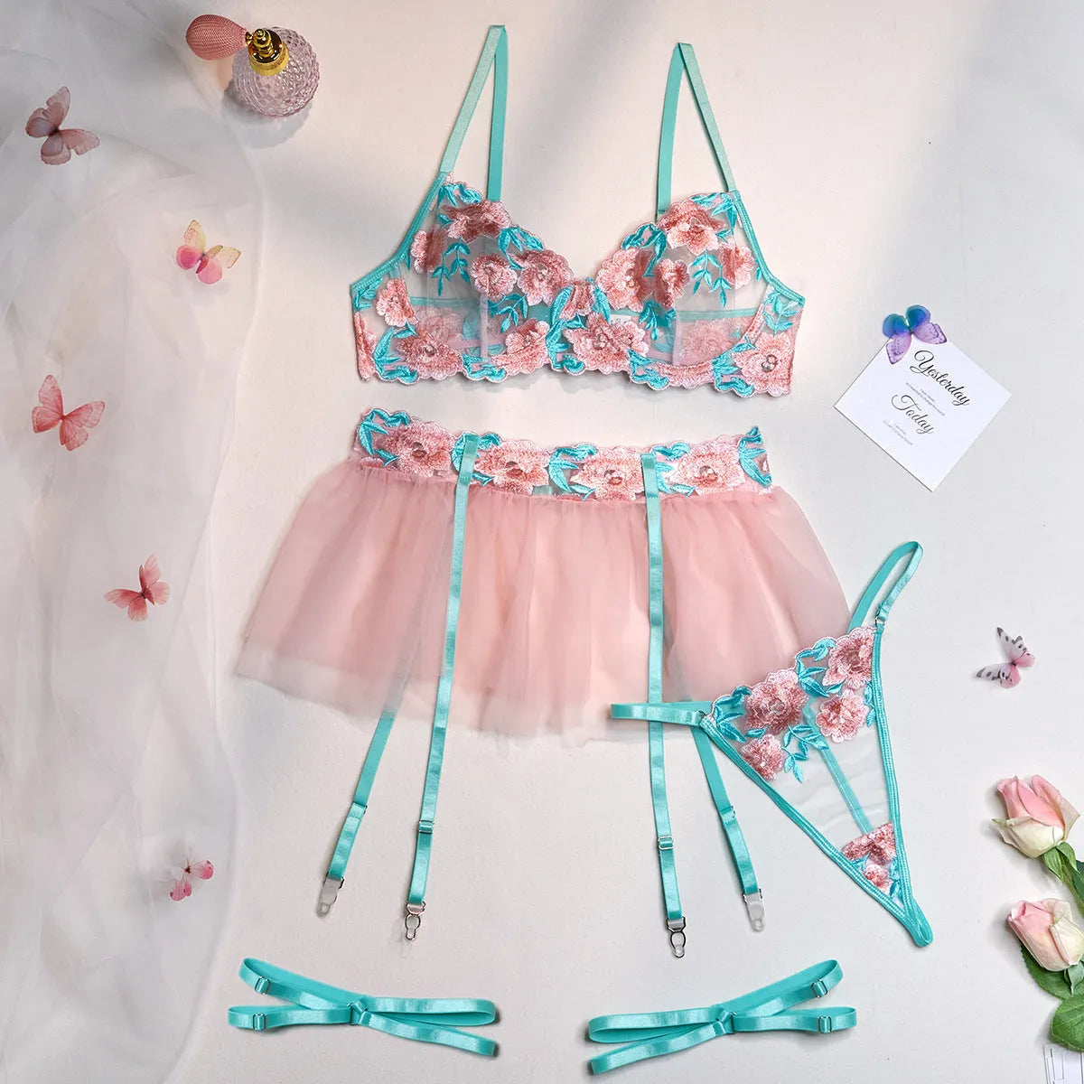 Pink women's mesh pettiskirt suit with embroidery detailing and bikini components