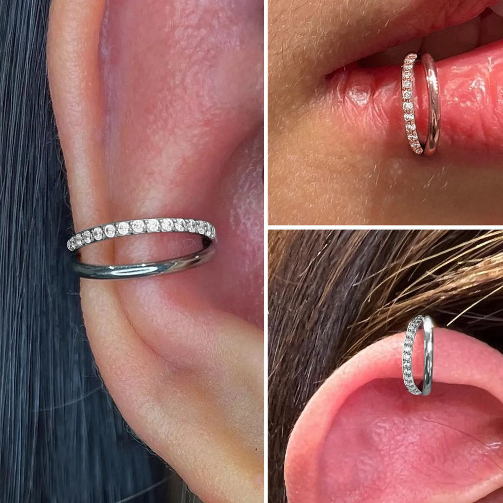 Titanium alloy nose ring or septum piercing in silver, available in multiple lengths and diamond-accented styles.