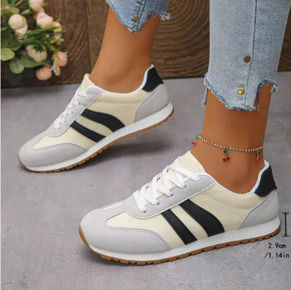 Blue and grey striped Cortez-style casual shoes with round toe and flat rubber sole