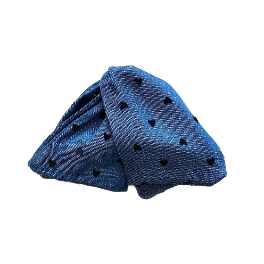 Women's denim bow hair clip with triangle grip, handmade from fabric and acrylic.