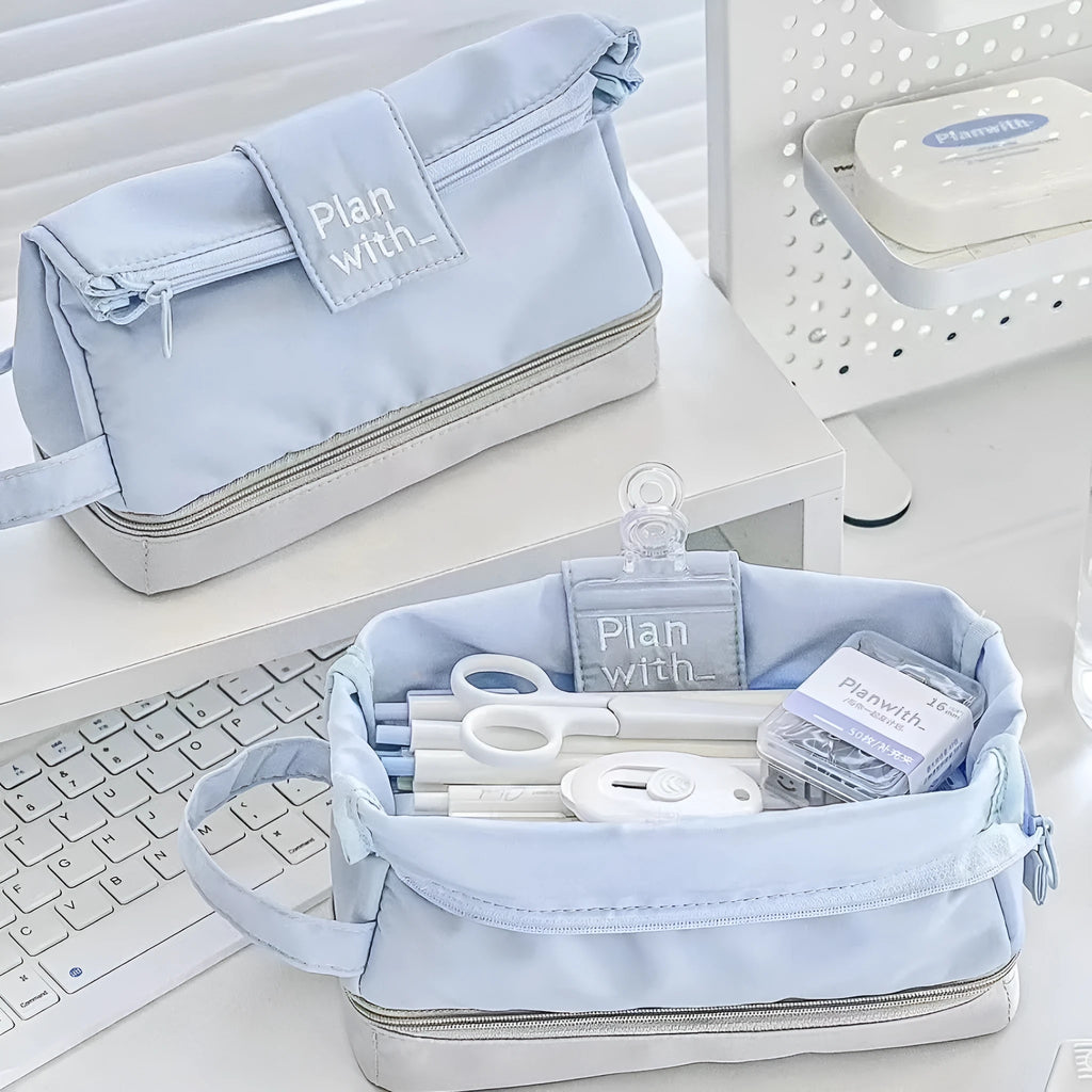 Fashion student pencil case in beige, blue, and navy blue, showing double layer open design.