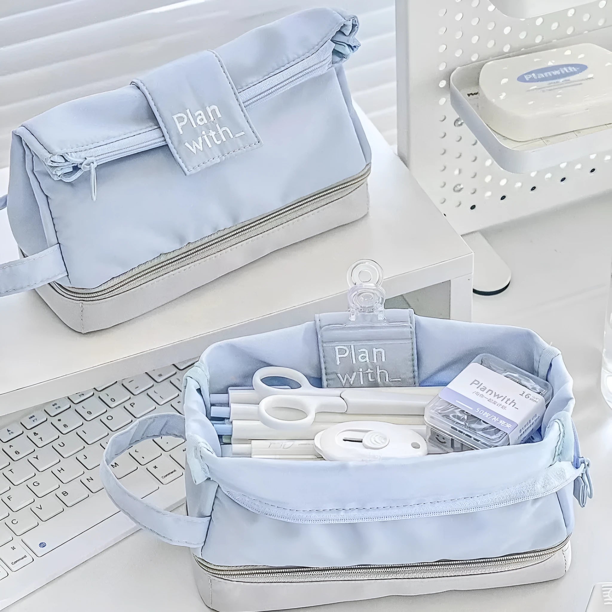 Fashion student pencil case in beige, blue, and navy blue, showing double layer open design.