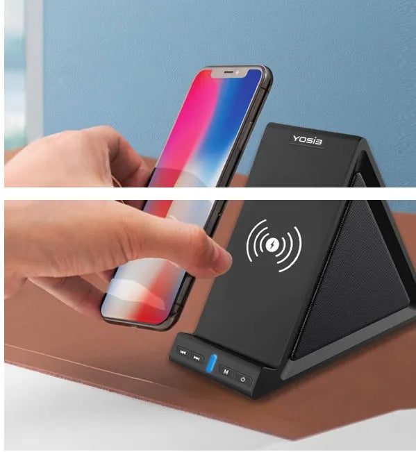 Black multifunctional Bluetooth speaker with integrated phone stand and wireless charging pad on top.