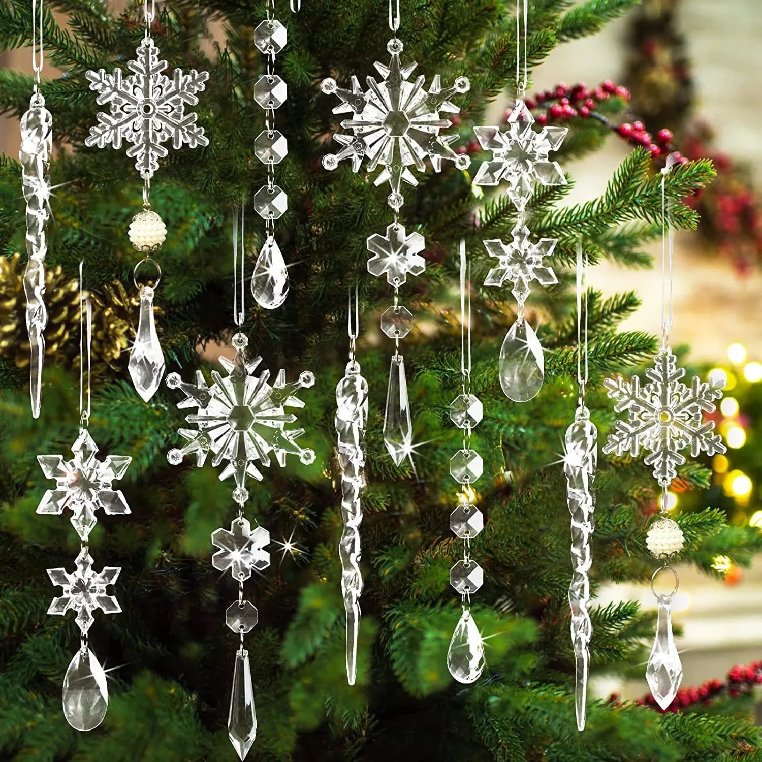 Ten clear acrylic icicle-shaped Christmas ornaments with white ribbons for hanging.