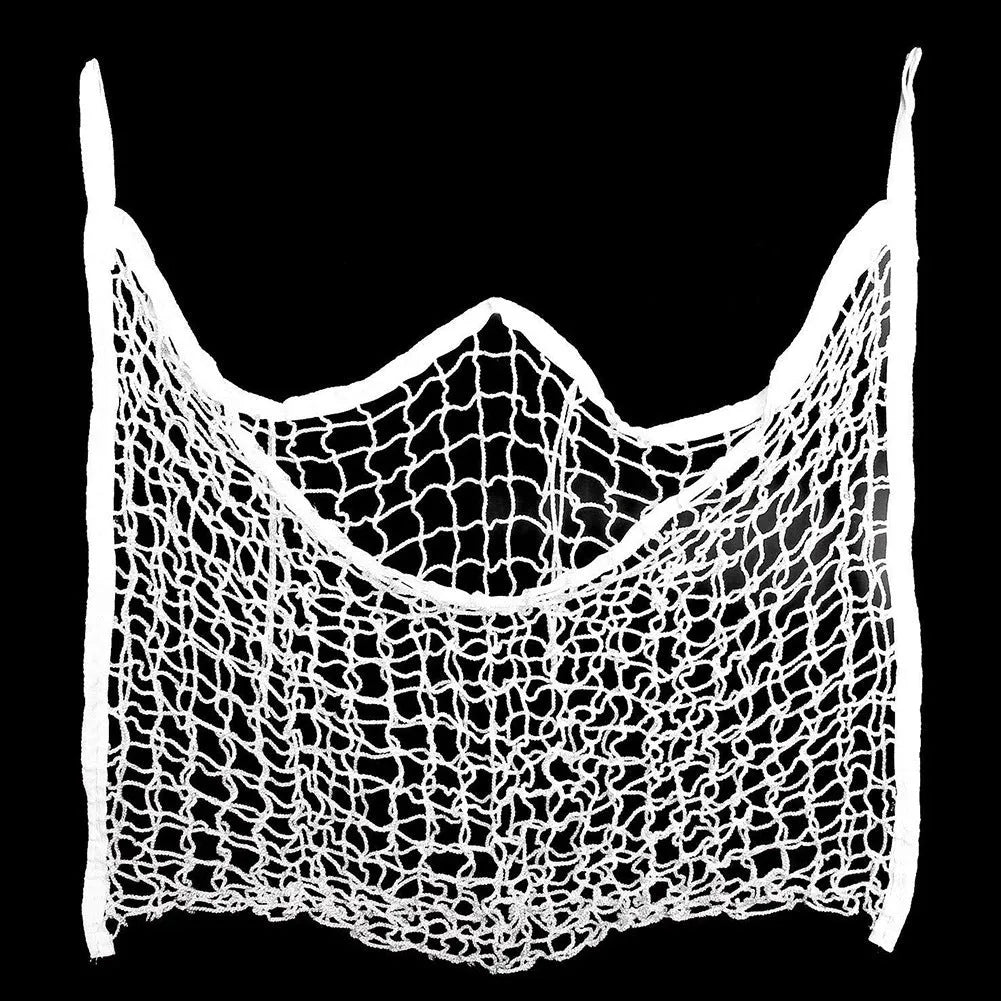 Woven polyethylene rope horse feeding bag in black hanging with hay visible through grid