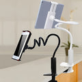 Black flexible mount holder with bendy arm holding a tablet, attached to a surface by a suction cup.