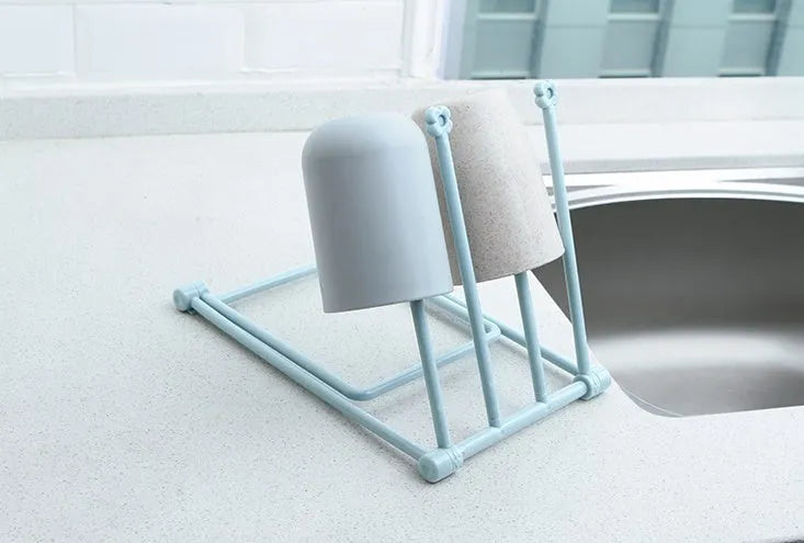 Foldable vertical dishcloth shelf in light blue with punch-free installation for kitchen organisation.