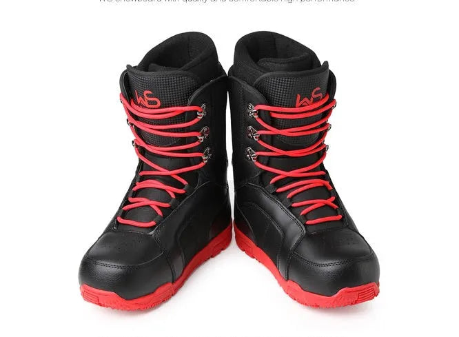 Black men's ski boots with tie closure and rubber outsole on a snowy surface