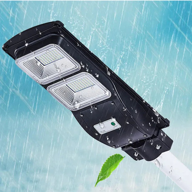 Integrated solar-powered 60W LED street light unit for outdoor installation.