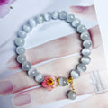Close-up of a white opal flower beaded bracelet in Chinese style, made from glass and coloured glaze.