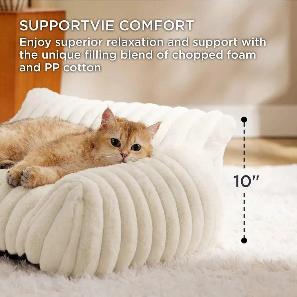Beige corduroy cat couch with high backrest for pet support on a wooden floor.