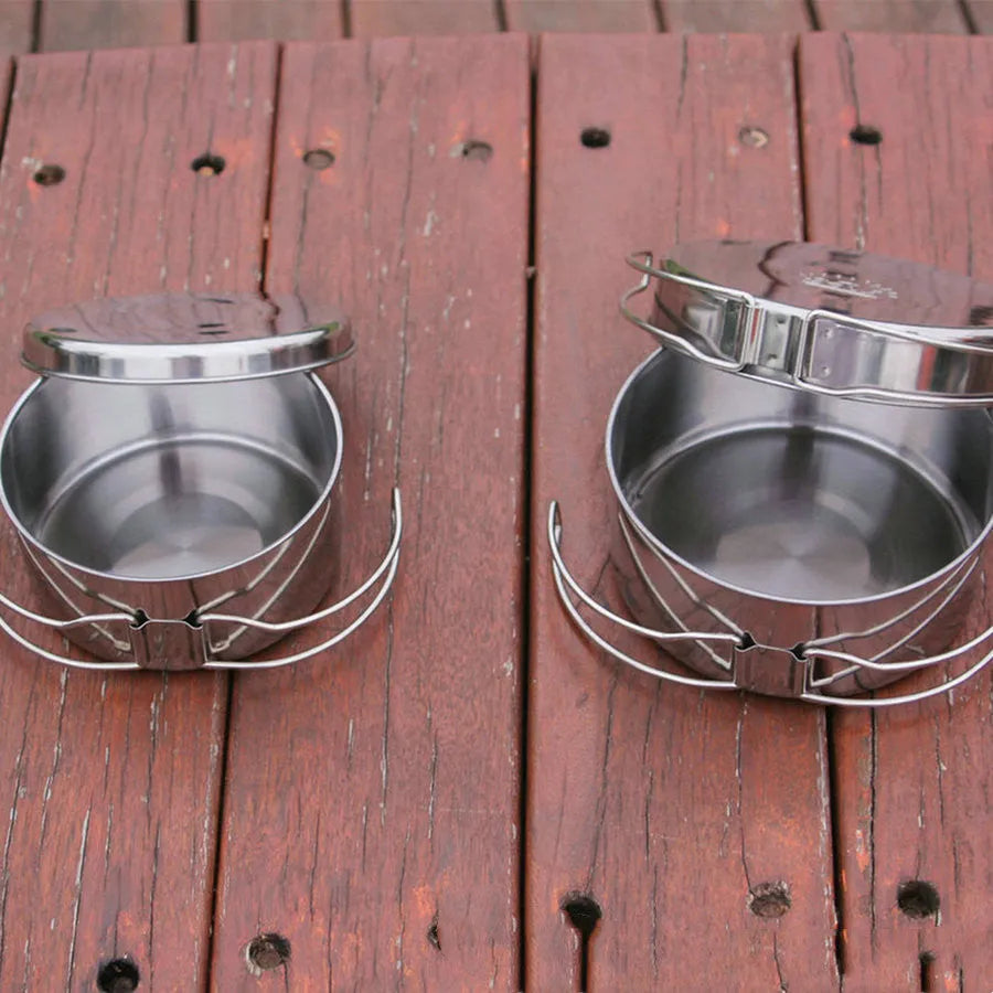 Silver stainless steel camping cookware set with four pieces for outdoor cooking