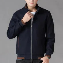Men's grey polyester fleece sports coat with long sleeves and side pockets.