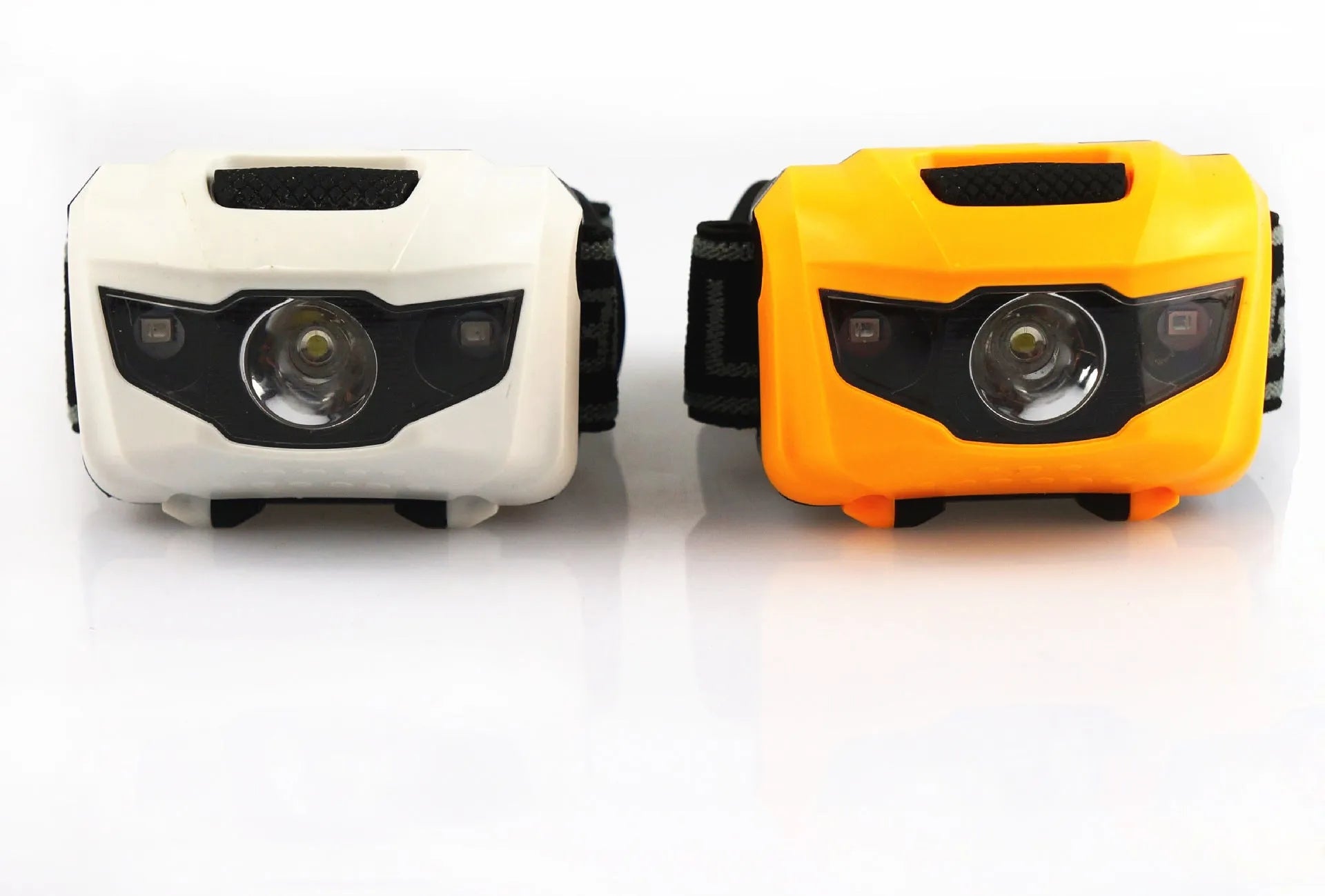 Black LED headlight with headband, showing white and red LEDs, for outdoor activities.