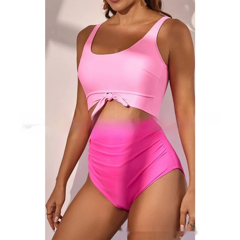 One-piece female swimsuit with contrast colour straps and covered belly in rose-red and black