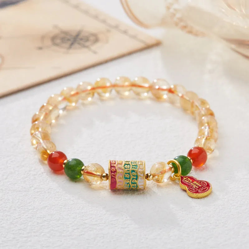 Hand-woven unisex bracelet with 6mm citrine beads in a five-sutra braid design.