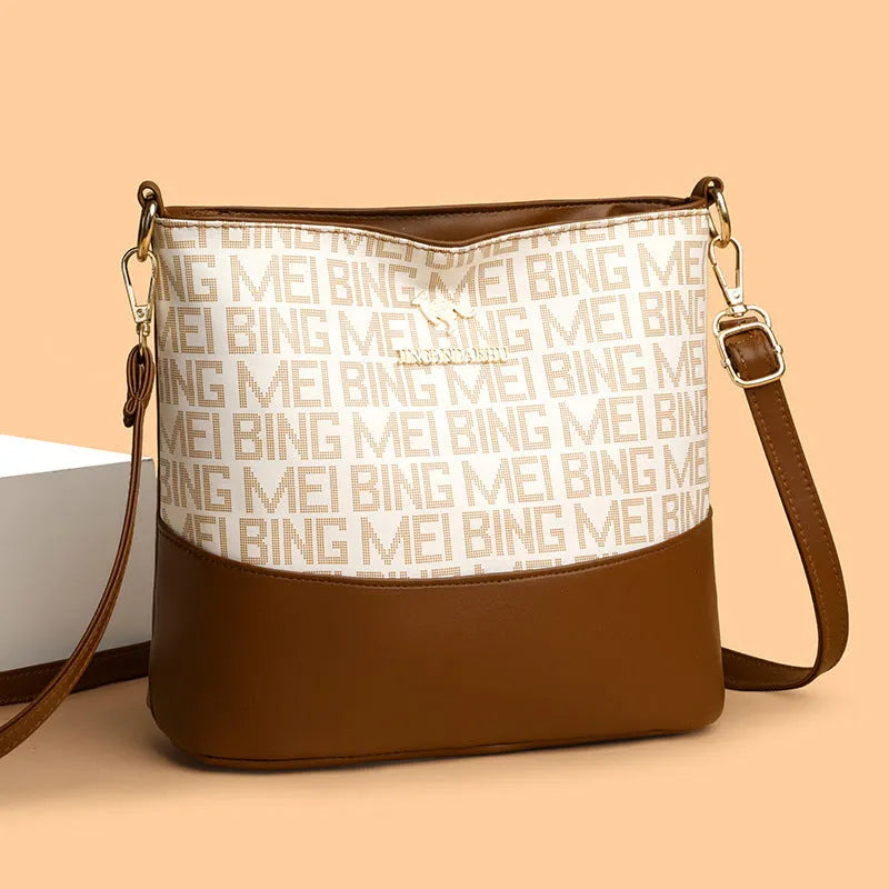 Brown soft PU leather messenger bag with external pocket and organised interior compartments.